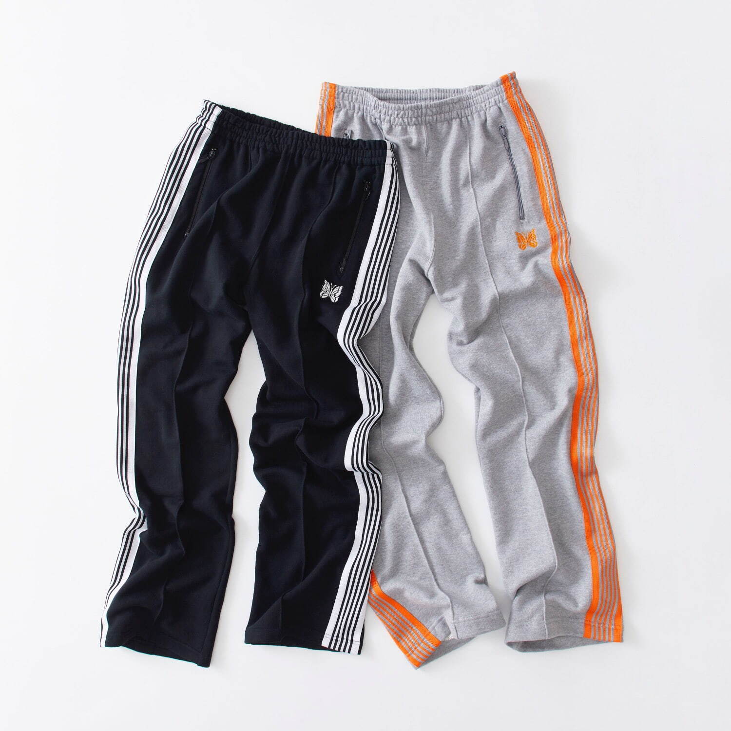 ニードルズ“鮮やかオレンジ”を効かせたスウェットトラックパンツ